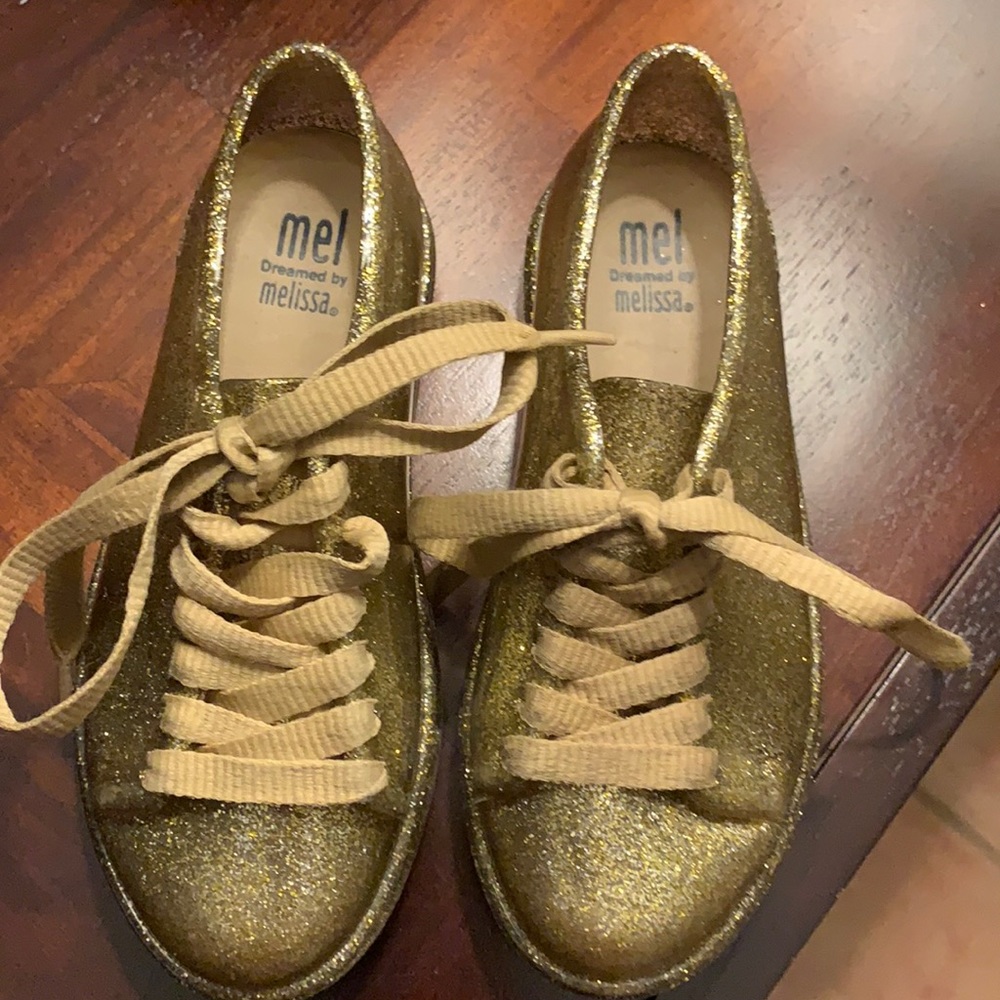 Gold , Mel by Melissa Shoes .